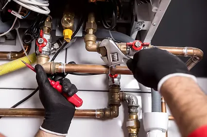 Close-up of plumbing repair work on copper water lines