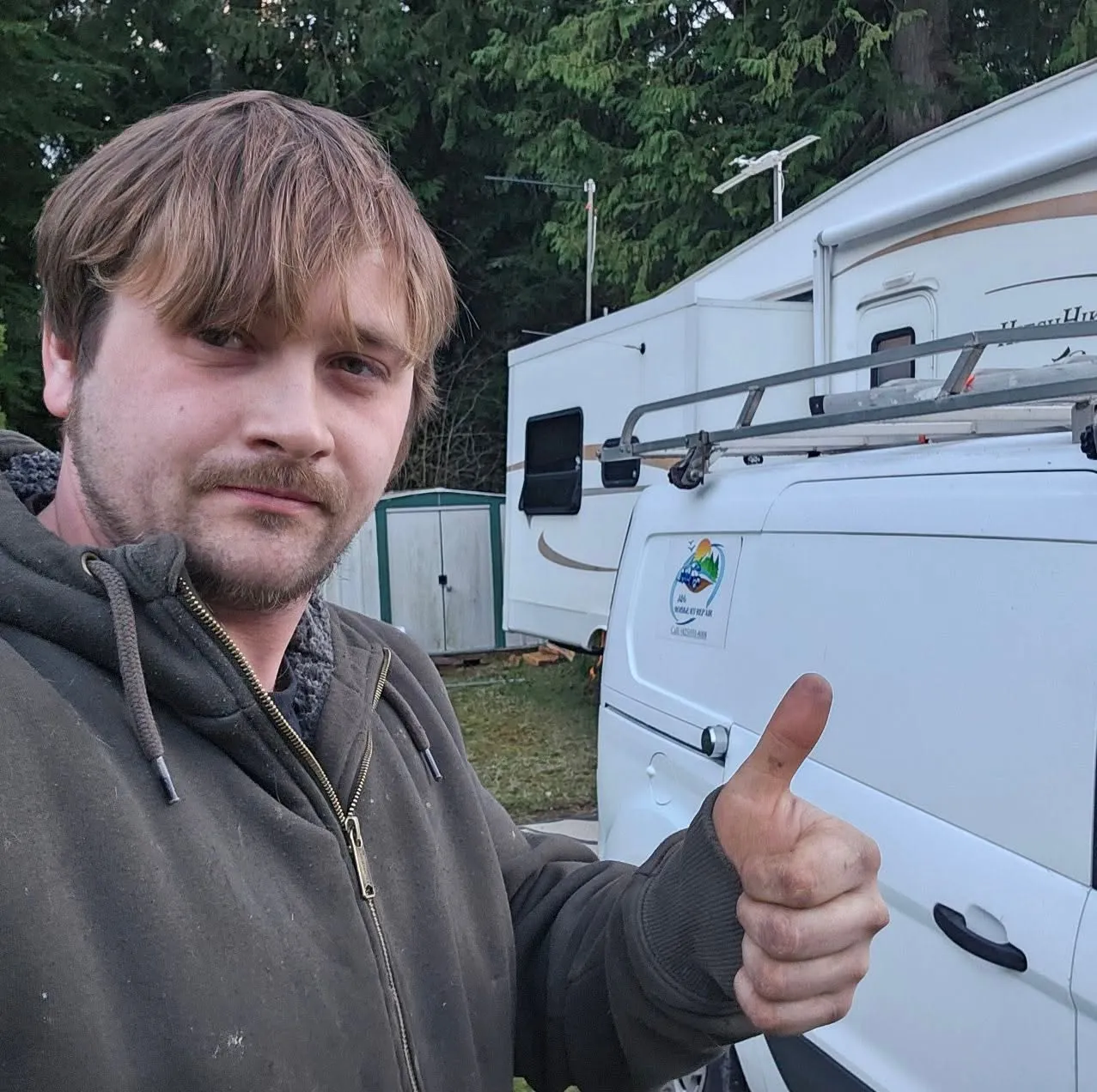 J&L Mobile RV Repair owner beside the company service van in Arlington, WA